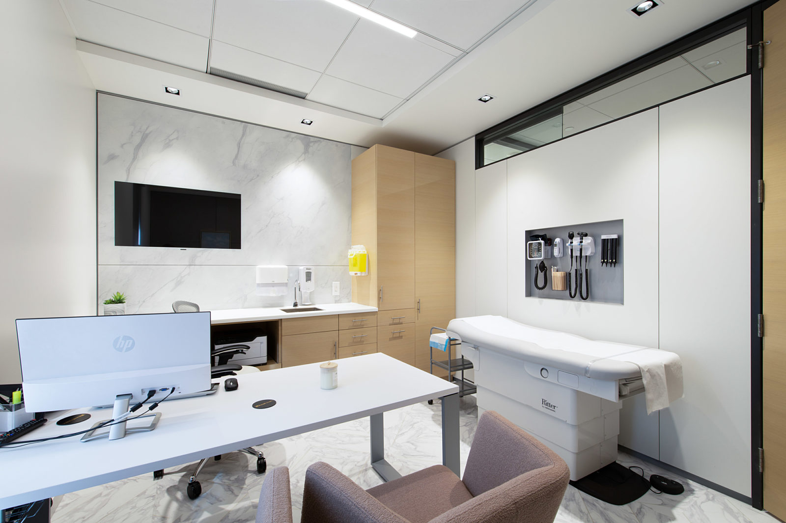 Medical exam and consultation room with DIRTT solution, integrated panels, technology and storage