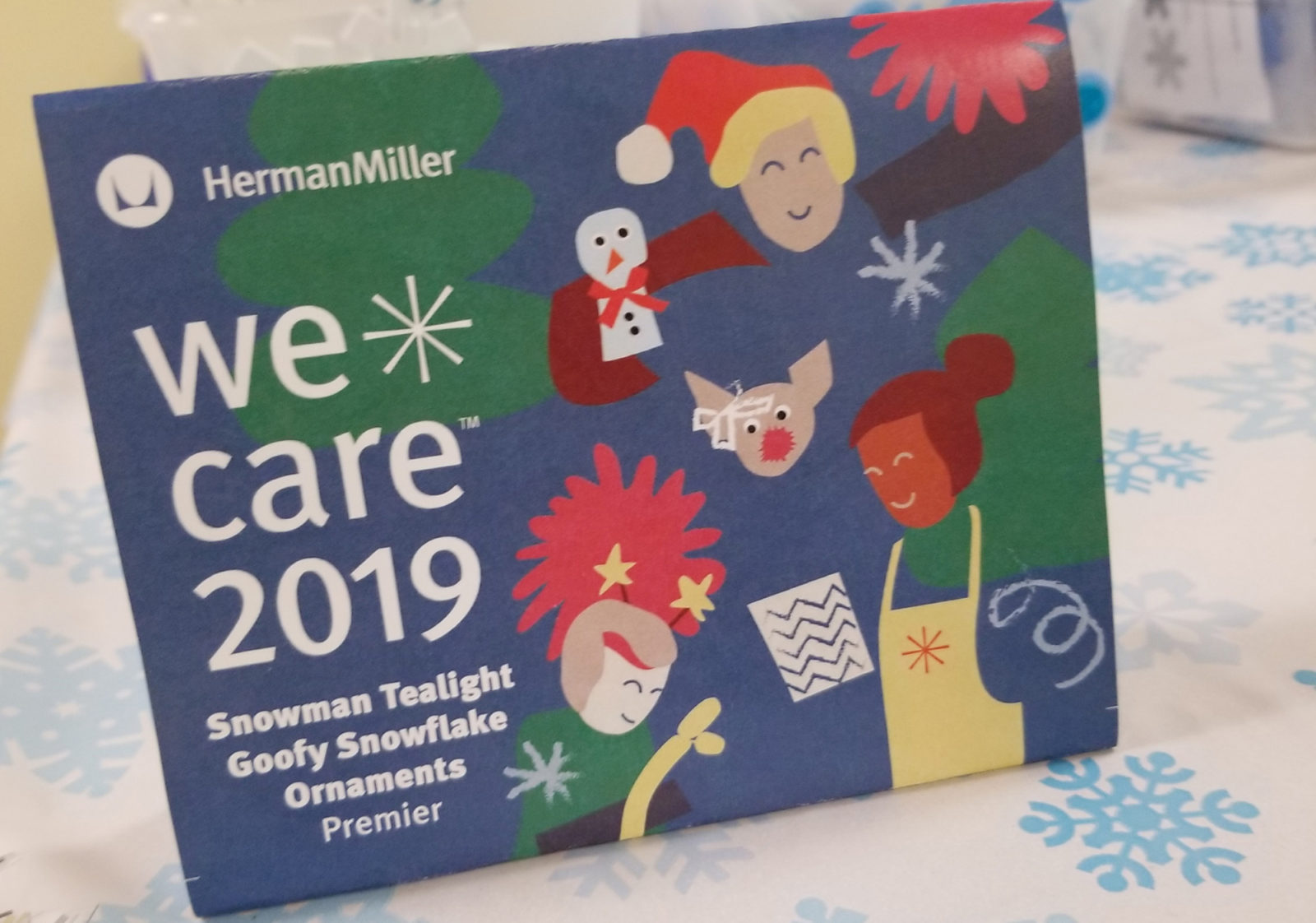 Post card for We Care 2019 event. The images are playful and colorful cartoons. There is also a list of crafts that Premier did at the event.